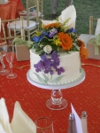 Cake centerpiece with floral topper